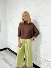 Load image into Gallery viewer, Lime green wide leg pants with front pleats and pockets.